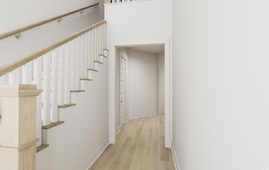 Stairs featuring hardwood / wood-style floors