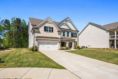 Brick and stone front home with level lot behind o