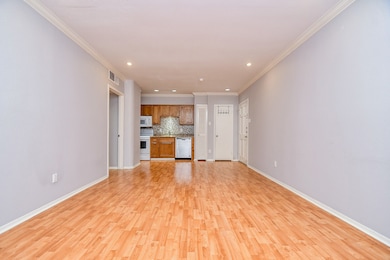 The spacious living area is large enough for den f