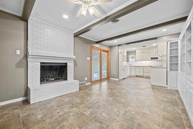 Unfurnished living room featuring ornamental moldi