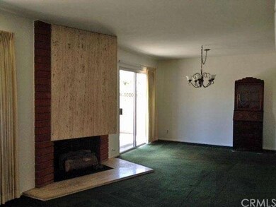 A large angled fireplace adds architectural intere