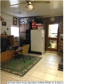 Den with attached kitchen