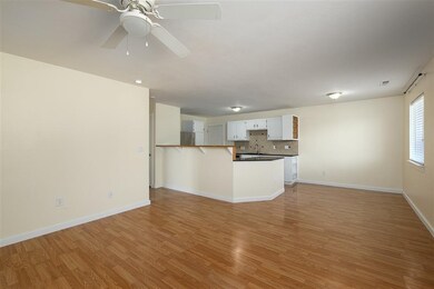 Living room flows right into the dining area and k