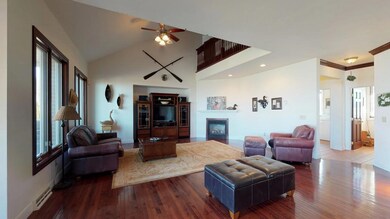 Open floor plan living room flowing from kitchen.