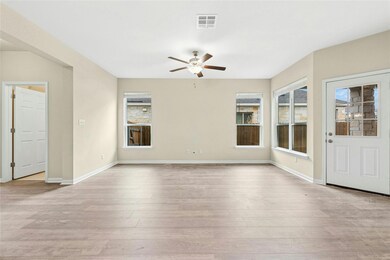 Spare room with ceiling fan, light wood-style flo