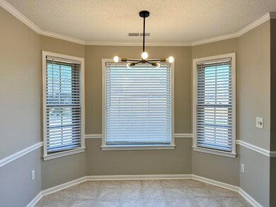 Unfurnished dining area featuring a notable chande
