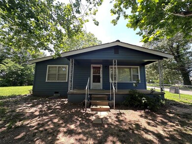 View of front facade featuring a porch and crawl space