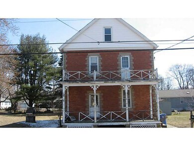 Exterior Front. Front porches need replacement.