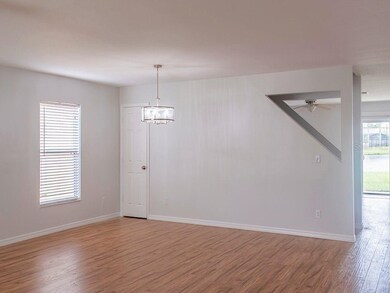Large open Dining Area with storage under stairs. 