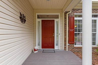 Entrance to property with brick siding