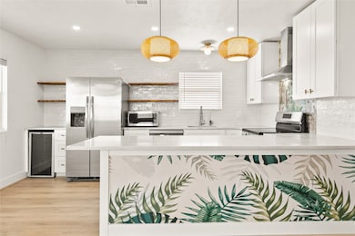 Redesigned kitchen with recent appliances, lighting fixtures, and more.