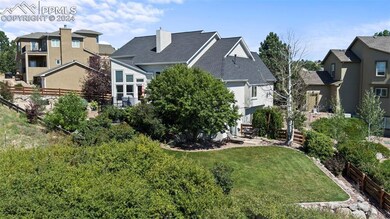 Rear view of property with a yard