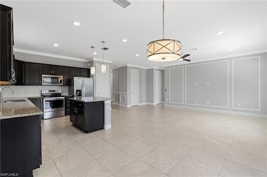 Kitchen featuring visible vents, decorative backsp