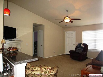 Living room / den with vaulted ceilings