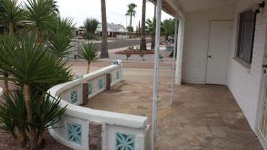 Front covered flagstone patio