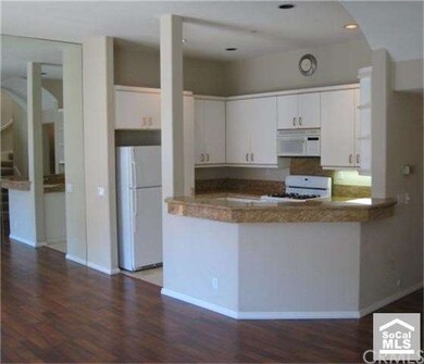 Another shot of the kitchen.  it opens to the livi
