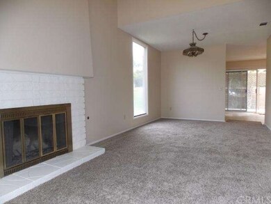Living room opens to formal dining room with floor