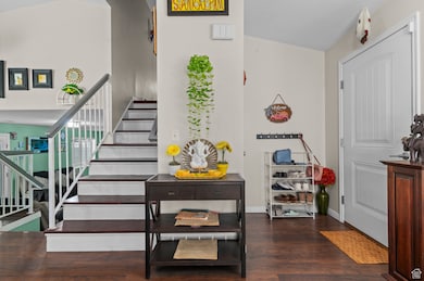 Stairs featuring wood finished floors and baseboards