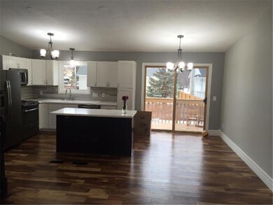 Another view of the kitchen showing the dining are