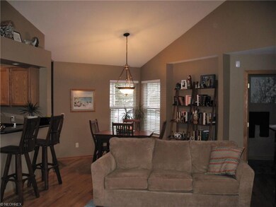 View into kitchen and dining area. It also has rec
