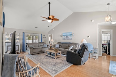 Living room featuring light wood-style flooring, h