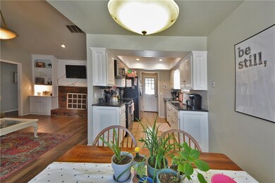 DINING AREA TO THE KITCHEN AND LIVING ROOM
