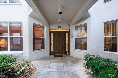 View of exterior entry featuring stucco siding