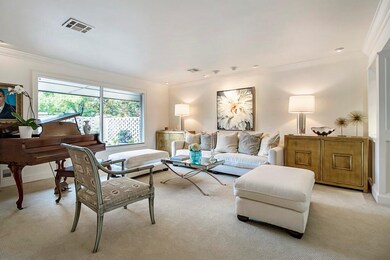 Formal living area with light colors and great nat