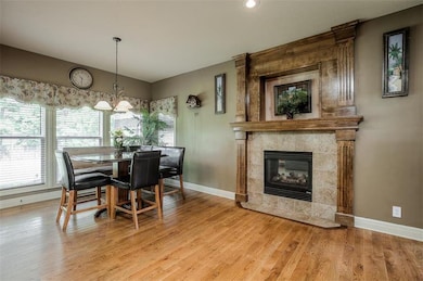 WARM BREAKFAST AREA WITH SEE-THROUGH FIREPLACE