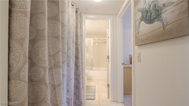 Hallway to guest room and guest bath. Washer & Dry