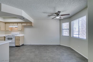 Kitchen featuring white electric range oven, under