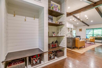 Mudroom with hardwood / wood-style flooring, vault