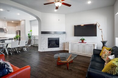 Living room with dark wood-type flooring, ceiling 