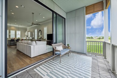 The living room features tri-fold sliders which op