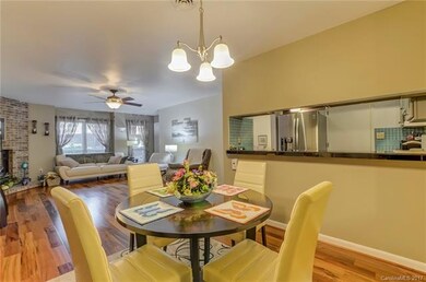 Window from dining area to look into the kitchen w