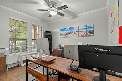 Home office located at the front of the home.  Com