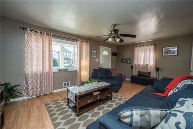 A large picture window floods the room with natura