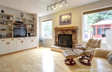 Living room w/ built-in's and fireplace