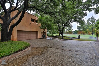 View of home's exterior featuring a garage and a l