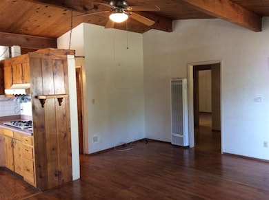 Living room off kitchen can be opened up more.