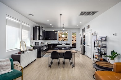 Dining area featuring light wood-style floors and recessed lighting