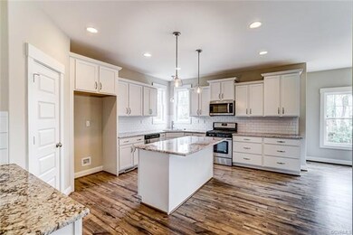 Kitchen with beautiful granite counter tops and su