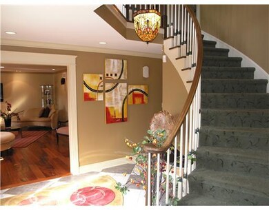 Entry/Foyer. Dramatic curved staircase in entrance