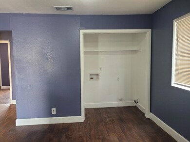 Washroom featuring laundry area, visible vents, w
