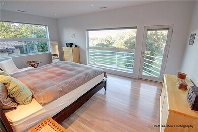 Master bedroom with private balcony.