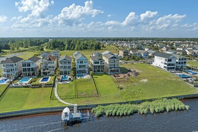 Aerial view of residential area featuring a large body of water