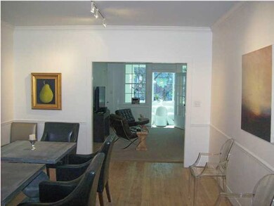 View of Dining into the Living and Sunroom beyond