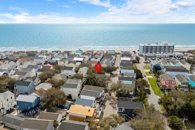 Aerial perspective of suburban area featuring a large body of water
