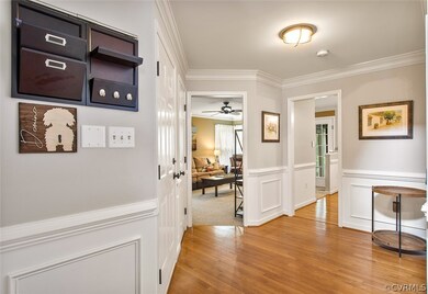 Foyer entry - hardwood, moldings, fresh paint & tr