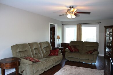 Hand-scraped laminate flooring + doors to patio